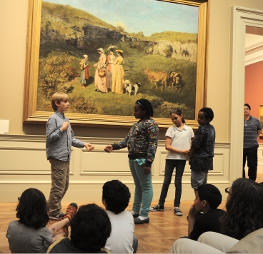 Students creating a tableau at the Met. Photo by Don Pollard.