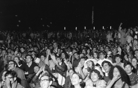Ten thousand spectators gathered to watch giant television screens in New York’s Central Park and cheer as astronaut Neil Armstrong took humanity’s first step on the moon on July 20, 1969. 
